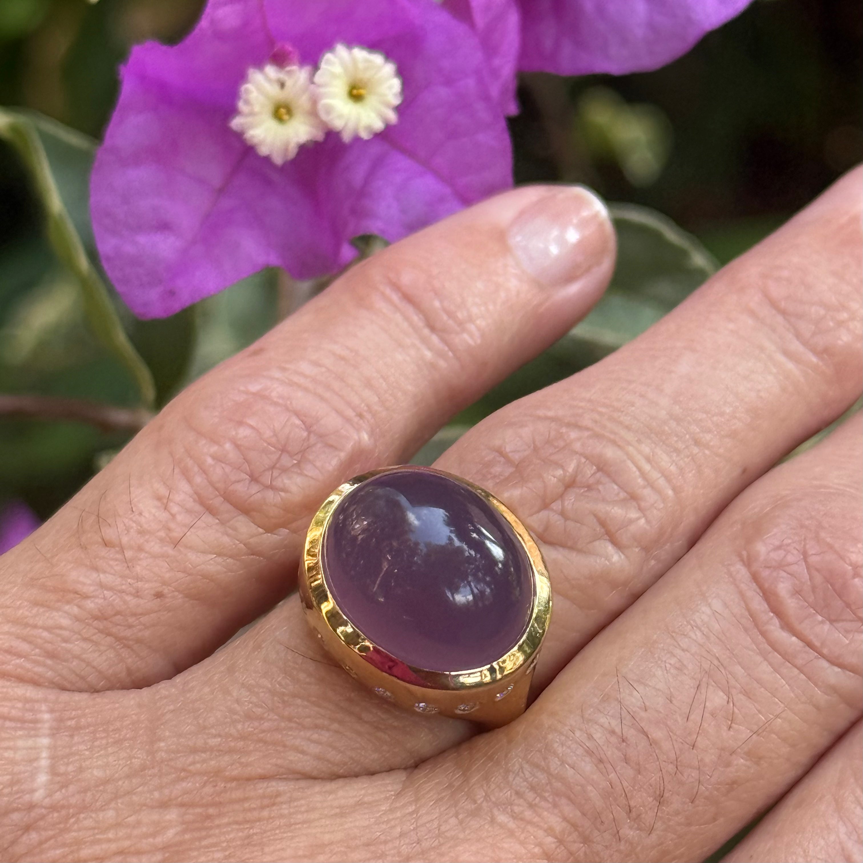 Gold ring with a purple chalcedony gemstone and small diamonds on hand- Ashleigh Bransteter